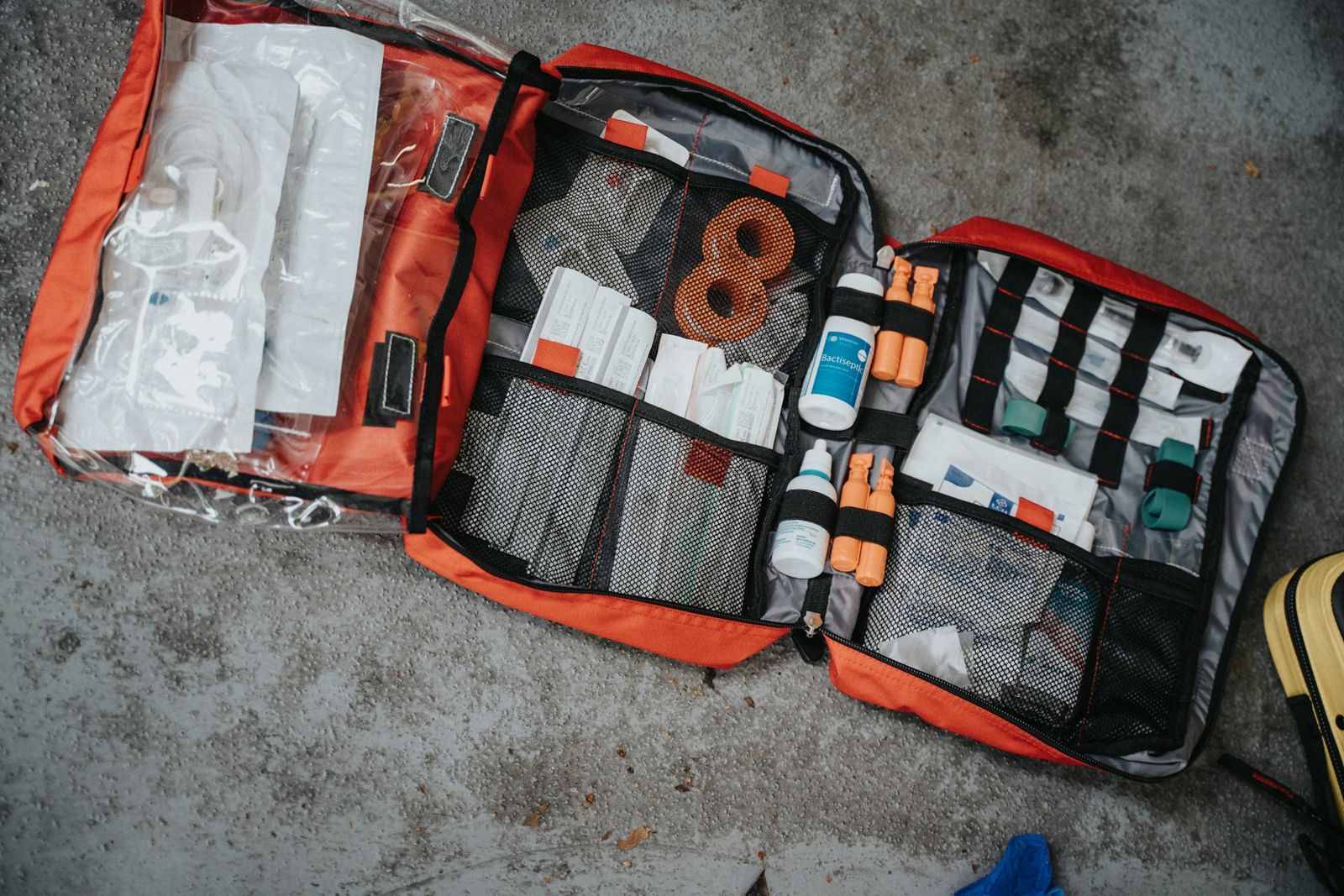Open first aid bag with bandages and supplies
